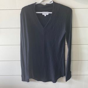 FEEL THE PIECE. Long sleeve black shirt.